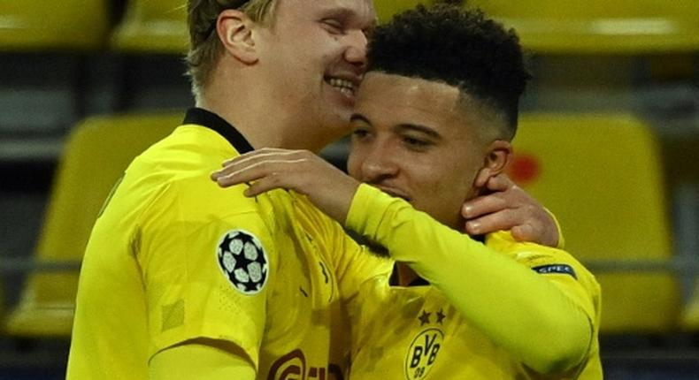 Jadon Sancho (R) celebrates his stunning free-kick with Dortmund teammate Erling Braut Haaland