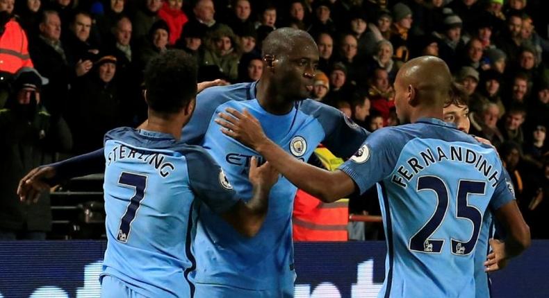 Manchester City's Yaya Toure (C) celebrates scoring a goal during their English Premier League match against Hull City, at the KCOM Stadium in Kingston upon Hull, on December 26, 2016