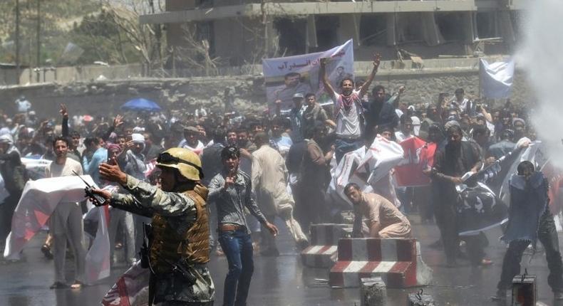 Afghan security forces use water canons to disperse protesters at an anti-government demonstration following a deadly truck bomb attack in Kabul on June 2, 2017