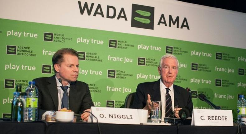 The World Anti-Doping Agency (WADA) President Craig Reedie (R) and Director General Olivier Niggli (L) speak at a press conference in Montreal on May 18, 2017
