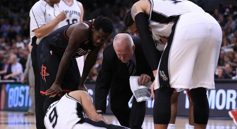 Tony Parker of the San Antonio Spurs lays on the floor after an injury against the Houston Rockets during Game Two of the NBA Western Conference Semi-Finals May 3, 2017 in San Antonio, Texas