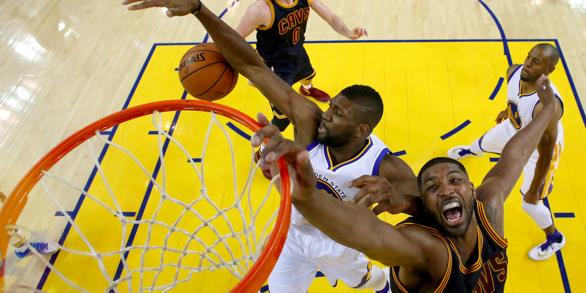 Tristan Thompson of the Cleveland Cavaliers and Festus Ezeli battle for the ball in the second half of Game 1 of the 2016 NBA.
