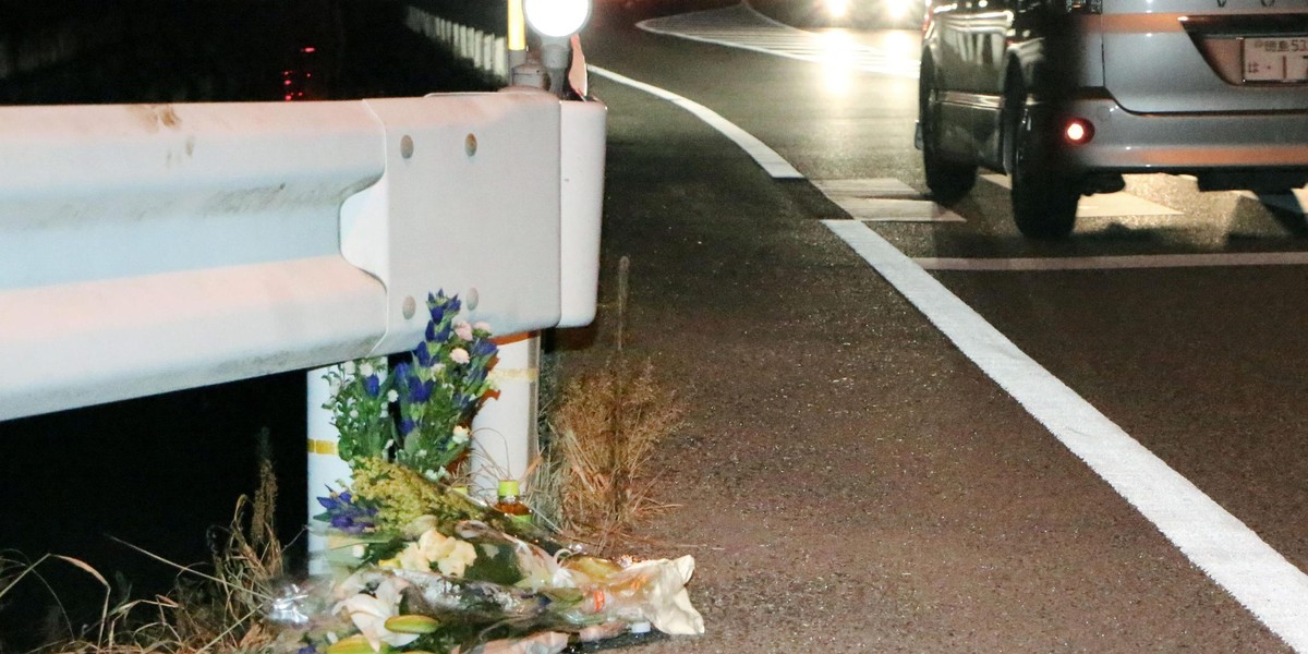 Flowers are laid near the scene where a passer-by was killed after being hit by a driver playing "Pokemon Go" while driving in Tokushima