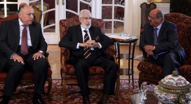 (L-R) Egypt Foreign Minister Sameh Shoukry, Libyan foreign minister Mohamed Tahar Siala and Algerian Minister of Maghreb Affairs, Abdelkader Messahel, chat during a meeting over the turmoil in Libya on January 21, 2017, in the capital Cairo