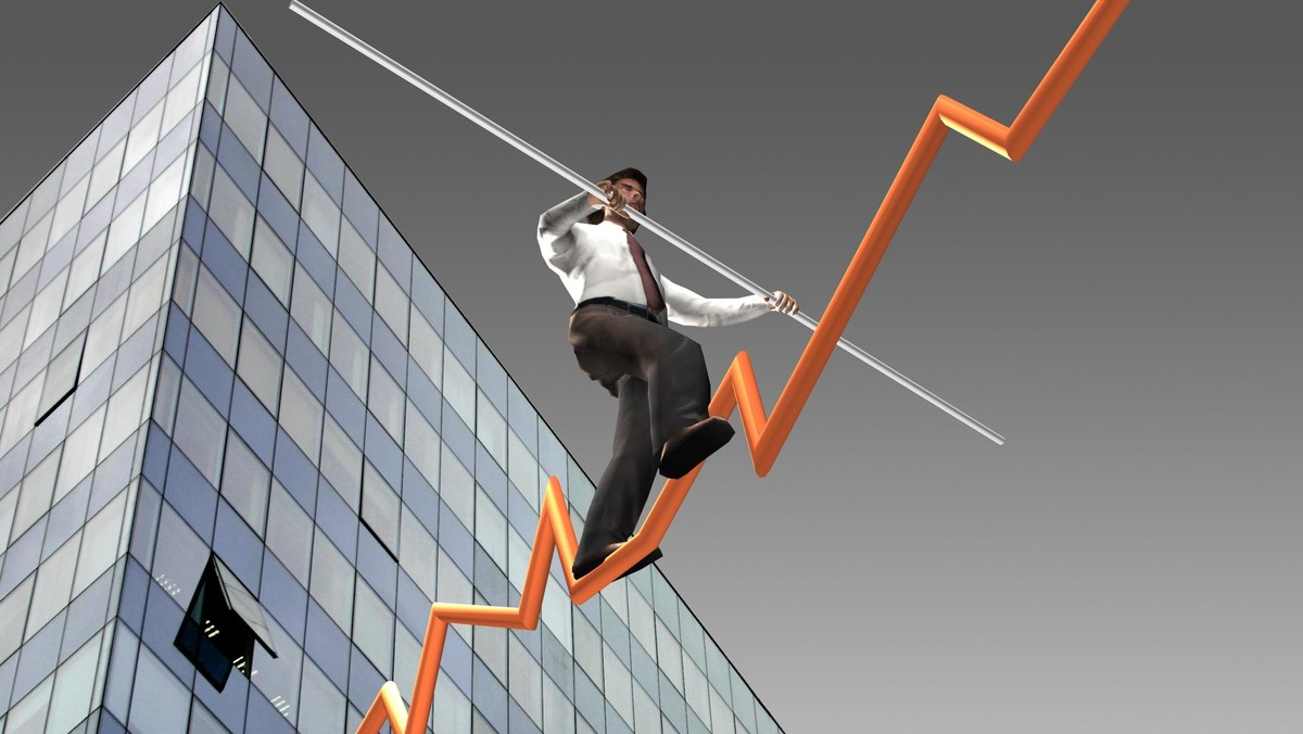 Businessman on a finance graphic aiming for the top..