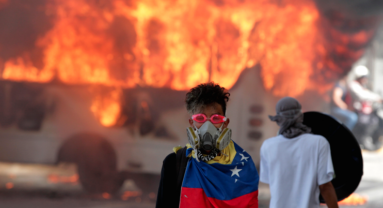 Demonstrators near a protest against Venezuelan President Nicolas Maduro's government in Caracas, Venezuela.