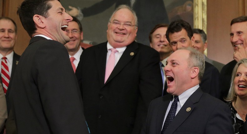 Speaker of the House Paul Ryan (R-WI) (3rd L) shares a laugh with Republican members of Congress.