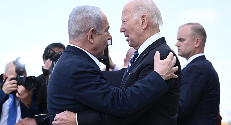 Israel Prime Minister Benjamin Netanyahu greeting US President Joe Biden on his arrival at Tel Aviv's Ben Gurion airport on October 18, 2023.BRENDAN SMIALOWSKI/Getty Images