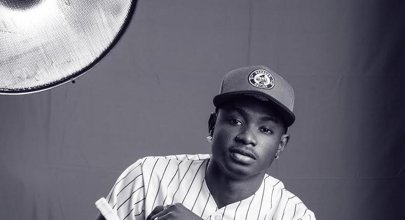Sepia image of Lil Kesh captured by Paul Ukonu Photography