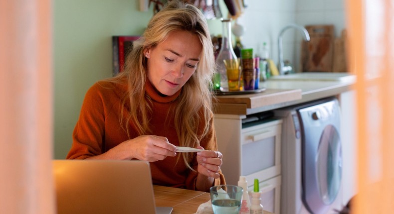 Constantly checking for symptoms of sickness and feeling extremely worried about your health are two signs of illness anxiety.Kathrin Ziegler/Getty Images