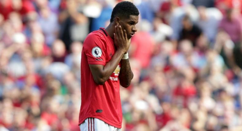 Manchester United striker Marcus Rashford reacts after mssing his penalty