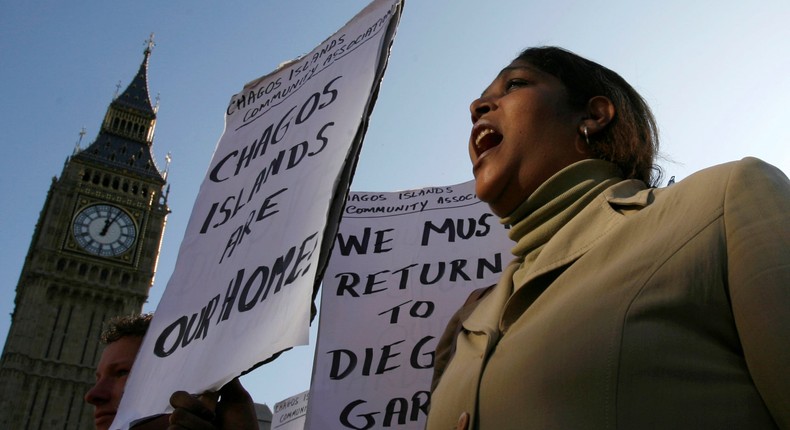 A protester protesting the illegal occupation of Chagos Islands by United Kingdom outside the Houses of Parliament in London.