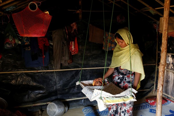 The Wider Image: Young Rohingya mothers flee persecution