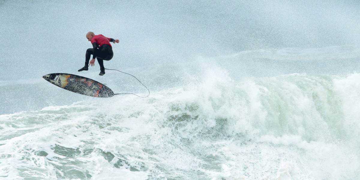 Australian surfer Justen Allport escaping a wave during the Cape Fear surfing tournament in heavy seas off Sydney's Cape Solander in Australia.