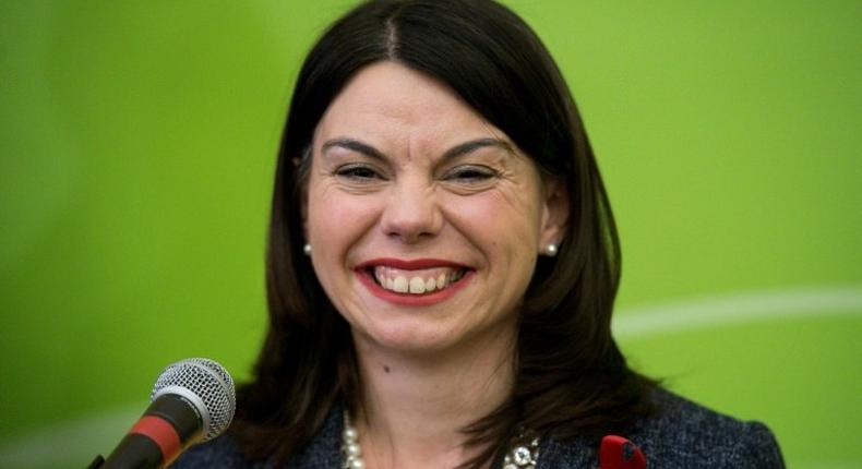 Newly elected Liberal Democrat MP Sarah Olney smiles on stage after winning a by-election in Richmond, southwest London, on December 2, 2016