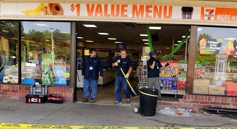 Crews clean up after a car crashed through the front door of a 7-Eleven in southeast Denver in 2012.RJ Sangosti/The Denver Post via Getty Images