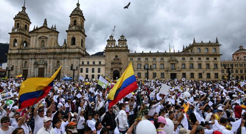 Thouusands march to condemn the Bogota police academy car bombing that killed 20 students