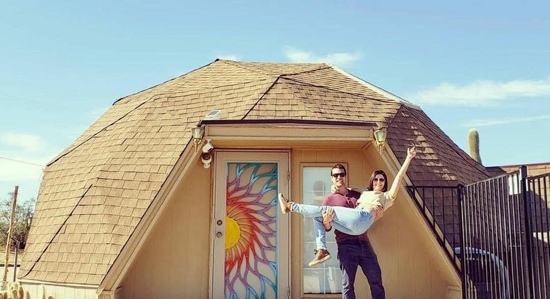 Stephanie and Blake Monroe in front of their dome house Airbnb.