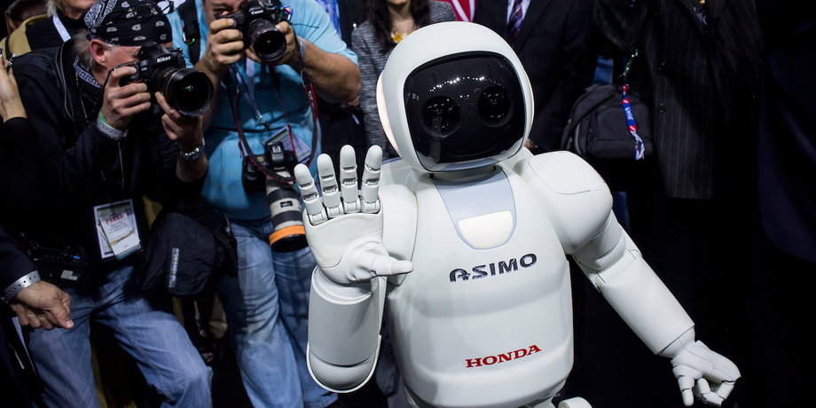Honda Motors demonstrates its Asimo robot during a media preview of the 2014 New York International Auto Show.