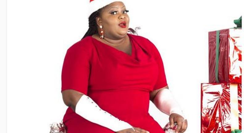 Eniola Badmus, in a Santa Clause demeanor.