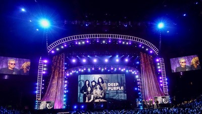 People listen to Gillan of Deep Purple speaks onstage at the 31st annual Rock and Roll Hall of Fame Induction Ceremony at the Barclays Center in Brooklyn