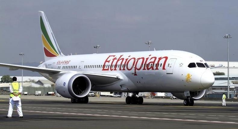 A member of the ground crew directs an Ethiopian Airlines plane at the Bole International Airport in Ethiopia's capital Addis Ababa, August 21, 2015.   REUTERS/Tiksa Negeri