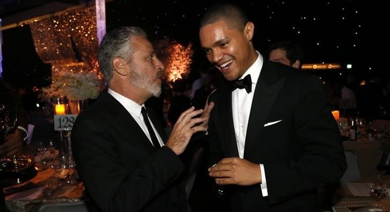 Television personality Jon Stewart (L) talks with actor Trevor Noah at the 67th Annual Primetime Emmy Awards Governors Ball in Los Angeles, California September 20, 2015. REUTERS/Mario Anzuoni