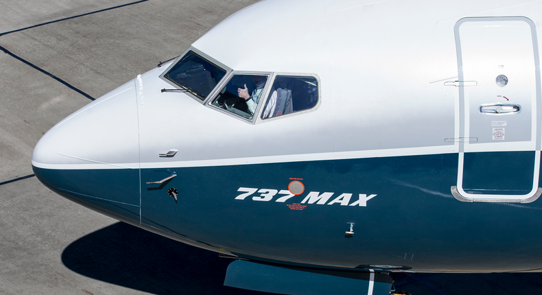Boeing test pilot Jim Webb gives a thumbs-up from the cockpit of a 737 MAX 7 at Boeing Field, on March 16, 2018 in Seattle, Washington, after completing the plane's first flight. The aircraft is the shortest variant of fuel efficient MAX family.