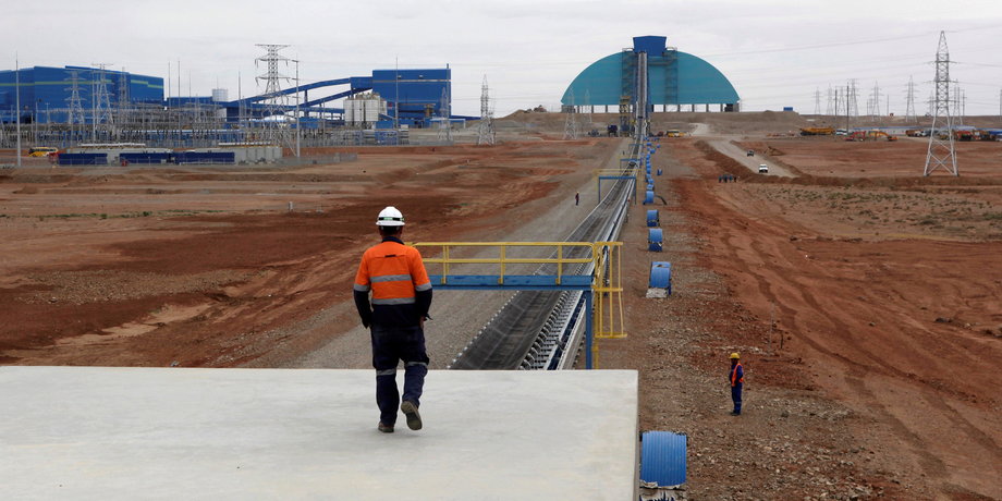 An employee looks at the Oyu Tolgoi mine in Mongolia's South Gobi region, June 23, 2012.