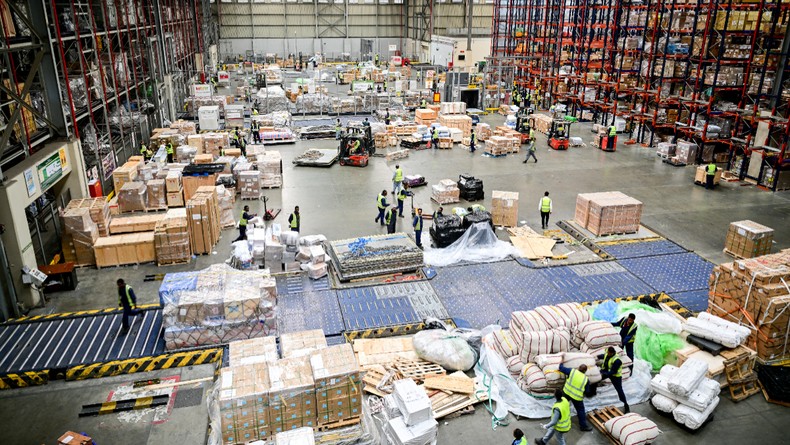 Workers load cargo at an Ethiopian Airlines cargo terminal during a visit by the business delegation on Foreign Minister Wadephul's trip. The Foreign Minister is visiting Kenya and Ethiopia. [Photo by Sebastian Gollnow/picture alliance via Getty Images]