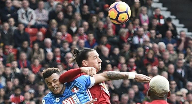 Manchester United's Zlatan Ibrahimovic (C) elbows Bournemouth's Tyrone Mings during the English Premier League match at Old Trafford, north west England, on March 4, 2017
