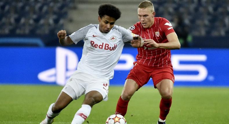 Germany forward Karim Adeyemi (L) scored three goals in the group stages to help Salzburg reach the last 16 of the Champions League Creator: HANS PUNZ