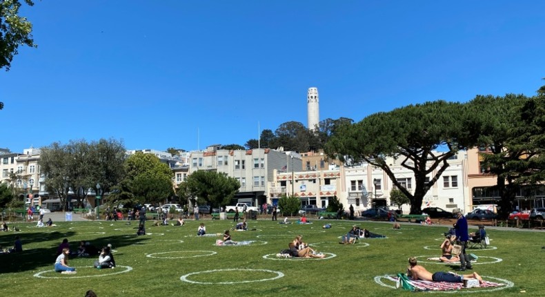 People practice social distancing at Washington square park in San Francisco