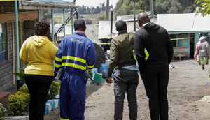 A Kenya Power employee at the scene of the Hillside Endarasha Academy fire