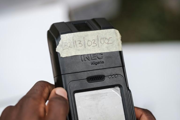 Voters can only cast their ballot by showing a biometric card, which is checked in a hand-held reader