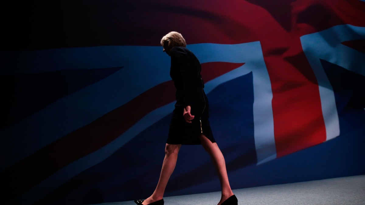 Britain's Home Secretary Theresa May leaves the stage after speaking on the third day of the Conserv