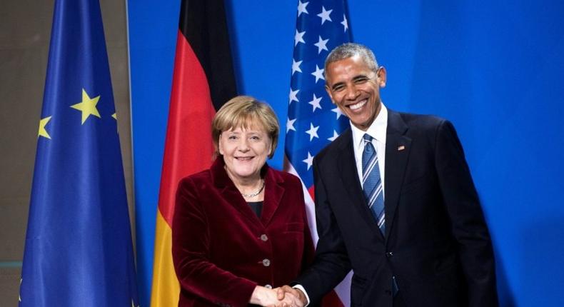 German Chancellor Angela Merkel and US President Barack Obama shake hands following a press conference at the Chancellery in Berlin in November 2016