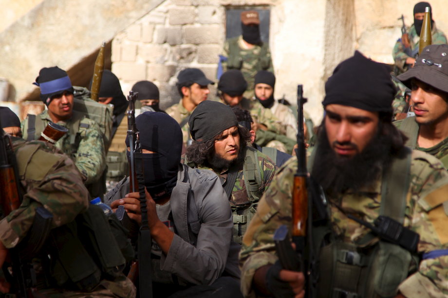 Members of the Nusra Front before moving toward their positions during an offensive to take control of Ariha from forces loyal to Syria's President Bashar Assad on May 28, 2015.