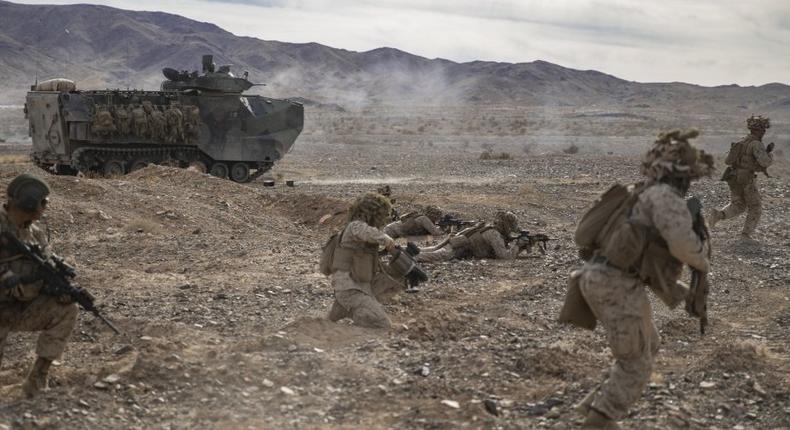 U.S. Marines with 2nd Platoon, Company C., 1st Battalion, 6th Marine Regiment conduct an assault beside Amphibious Assault Vehicles during a Mechanized Assault Course for Integrated Training Exercise (ITX) 1-20 on Marine Air Ground Combat Center, Twenty-Nine Palms, California