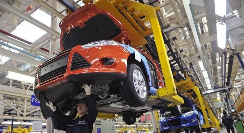 An employee works at an assembly line at a Ford manufacturing plant in Chongqing municipality April 20, 2012. 