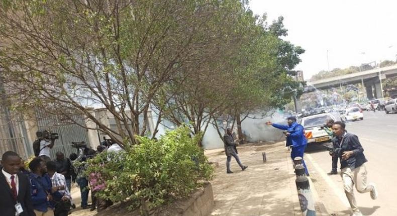 Police lob teargas at MPs from the Azimio la Umoja One Kenya Alliance during a protest at the Independent Electoral and Boundaries Commission offices in Nairobi on September 26, 2022