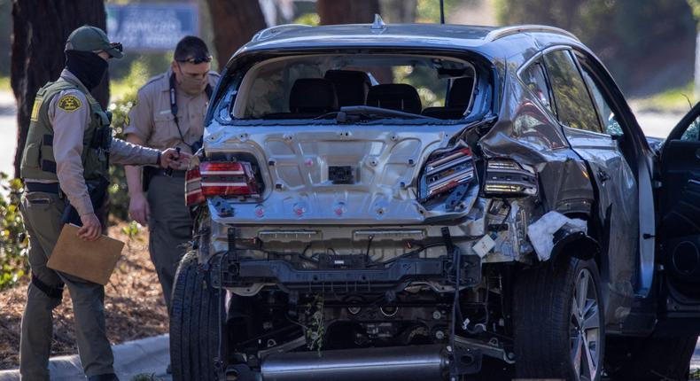 Los Angeles County Sheriff deputies gather evidence from the car that golf legend Tiger Woods was driving when seriously injured in a rollover accident on February 23, 2021 in Rolling Hills Estates, California. Rescuers used hydraulic rescue tools to extricate him from the car where he reportedly sustained major leg injuries. Law enforcement reports that there was no evidence of impairment. He was in town to participate in The Genesis Invitational golf tournament.
