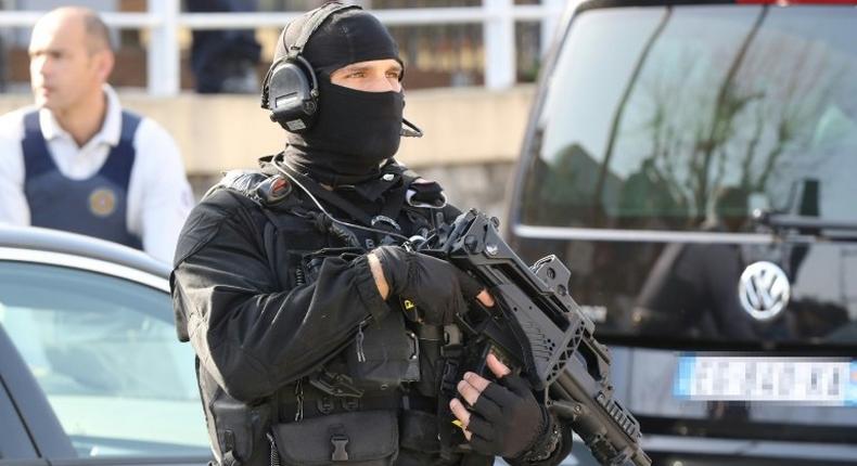 A member of the French RAID police unit on duty near the scene of a shooting at a school in the southern town of Grasse on March 16, 2017