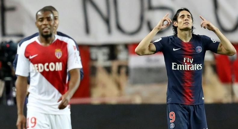 Edinson Cavani (R) celebrates after scoring one of his goals in Paris Saint-Germain's 4-0 win over Thierry Henry's Monaco