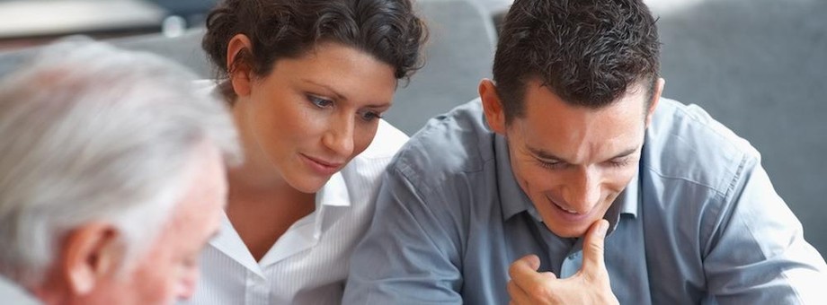 Banking agent explaining an investment scheme to a couple