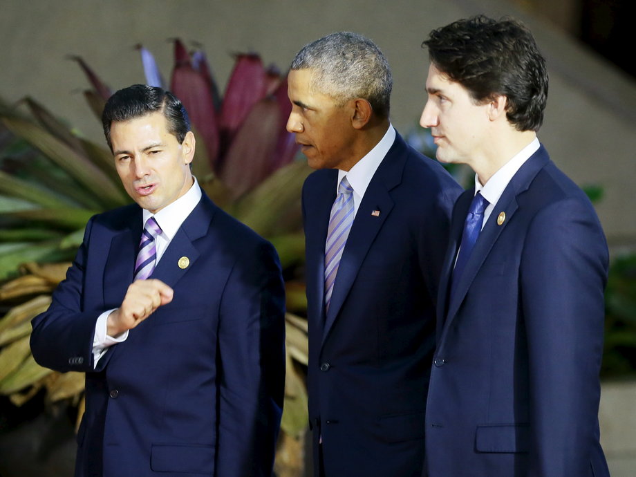 Mexican President Enrique Pena Nieto, left, gestures as he talks with US President Barack Obama, center, and Canadian Prime Minister Justin Trudeau prior to a group photo at the Asia-Pacific Economic Cooperation (APEC) summit in Manila, November 19, 2015.
