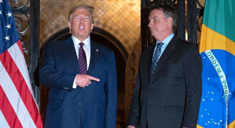 Then-President Donald Trump (l) and Brazilian President Jair Bolsonaro during a dinner at Mar-a-Lago, Florida, on March 7, 2020.JIM WATSON/AFP via Getty Images