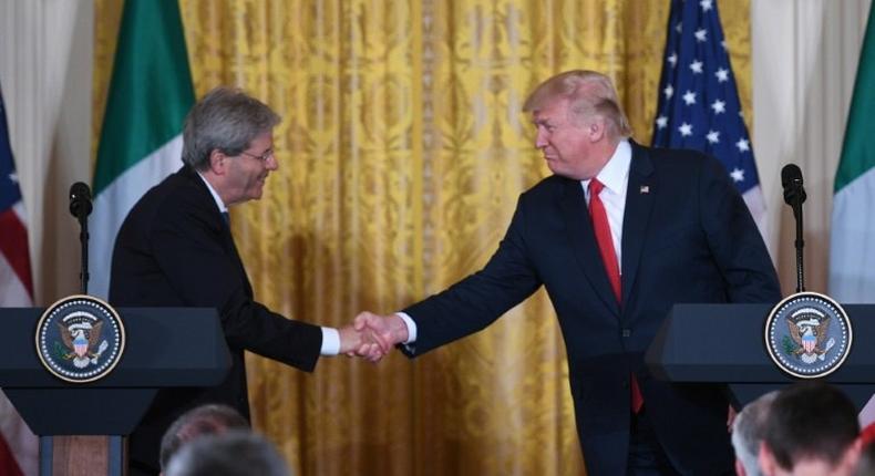 US President Donald Trump shakes hands with Italian Prime Minister Paolo Gentiloni during a joint press conference at the White House in Washington, DC, April 20, 2017