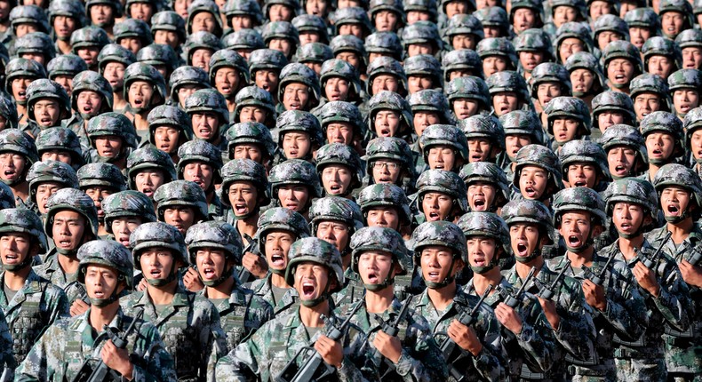 Soldiers of China's People's Liberation Army getting ready for the military parade to commemorate the 90th anniversary of the foundation of the army at Zhurihe military training base in Inner Mongolia Autonomous Region, China.