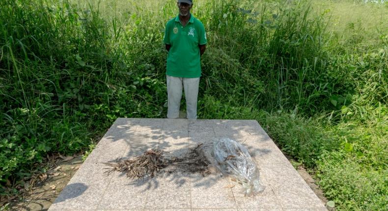 Louis Marie Mang, a UPC activist, stands before the tomb of anti-colonialist leader Ruben Um Nyobe